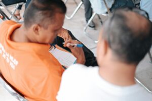 a few men sitting in chairs